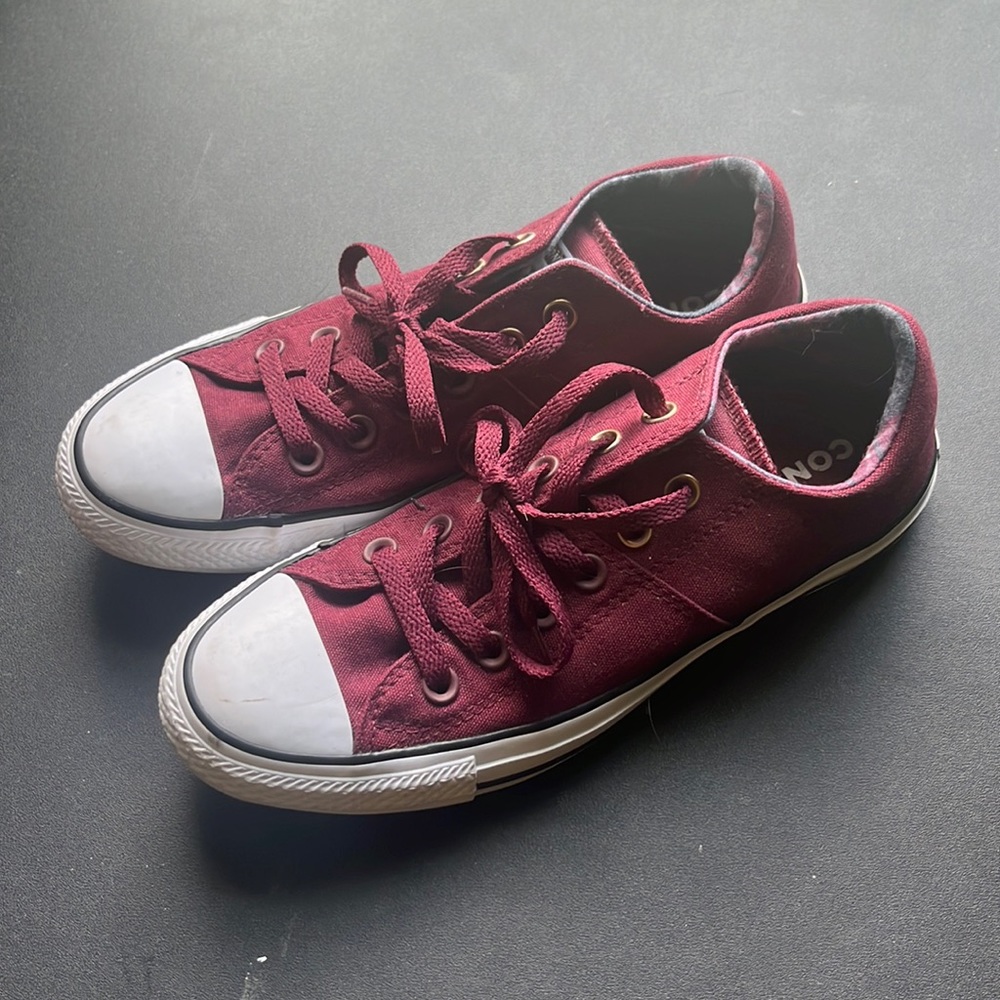 Burgundy Converse low tops with plaid inside and gold accents